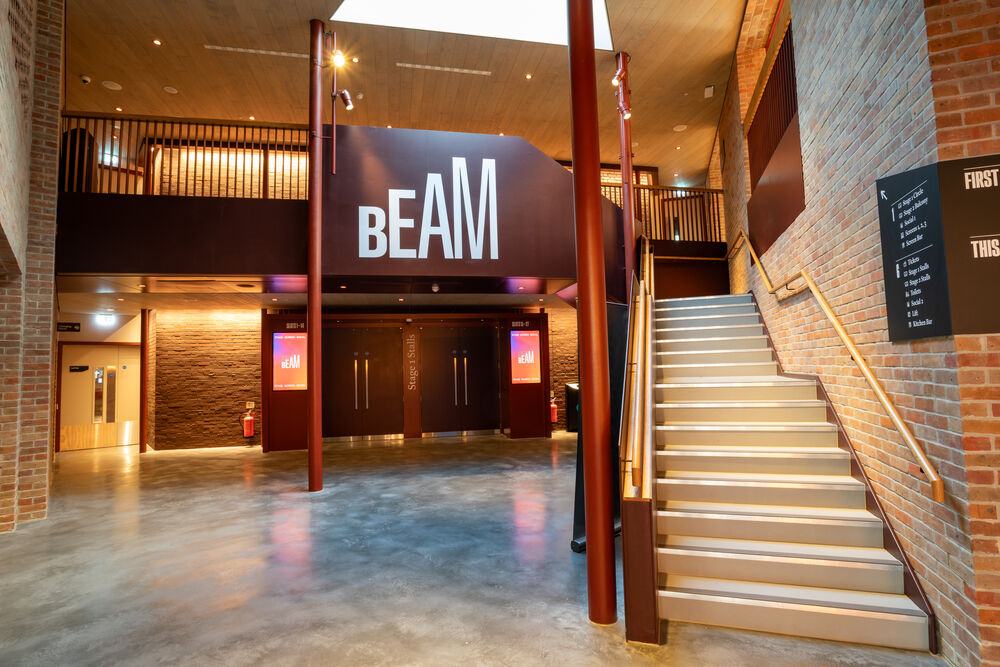 Foyer of BEAM with staircase on the right and sky light above