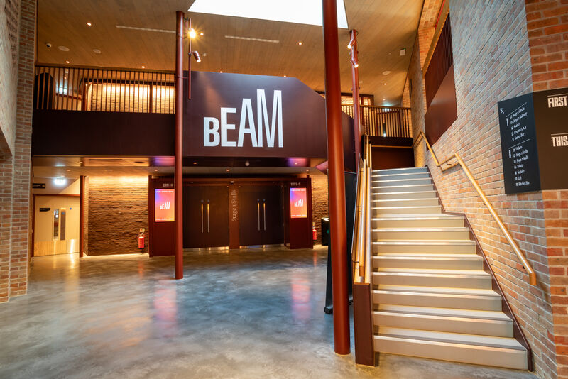 Foyer of BEAM with staircase on the right and sky light above