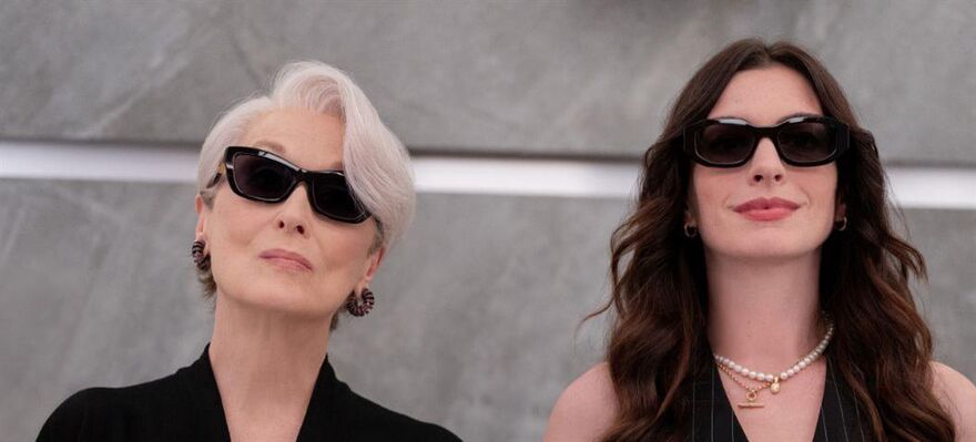 Miranda and Andy standing together in a lift