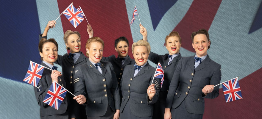 The D-Day Darlings waving Union Jack Flags