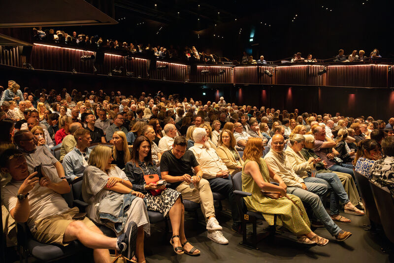 Stage 1 audience with a full auditorium