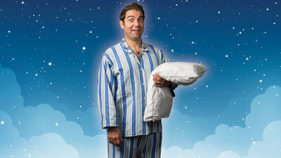 Mr Sleepybum holding a pillow