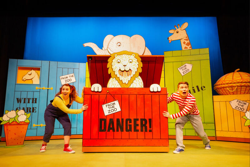 A lion popping out of a red box