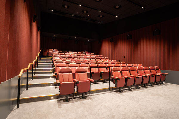 Cinema screen with red seats
