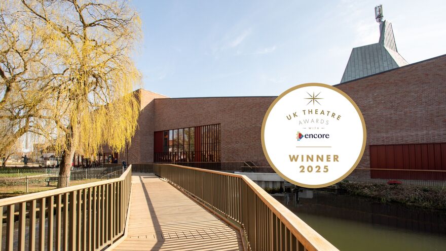 Exterior of BEAM (Venue). Brick walls on a sunny day.. UK Theatre Award Winner logo on the right (2025)