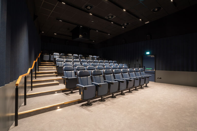 Cinema screen with blue seats