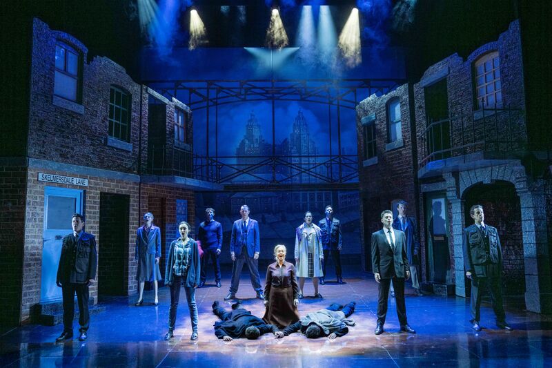 principle cast singing on stage