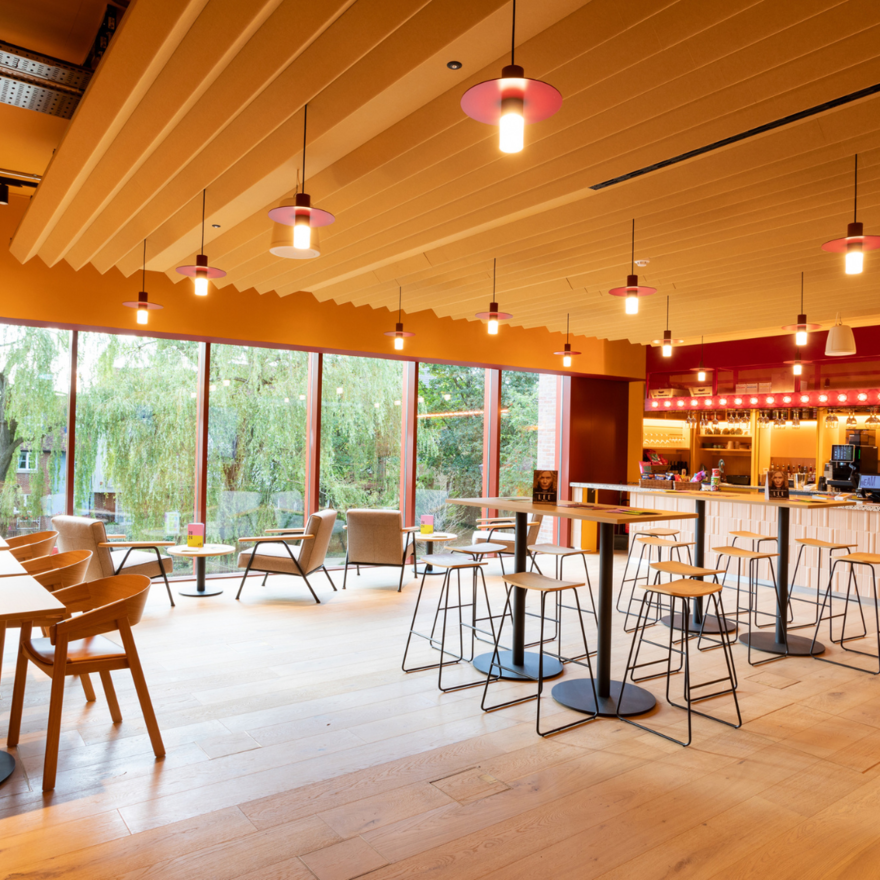 Bright bar with stools and floor to celling windows