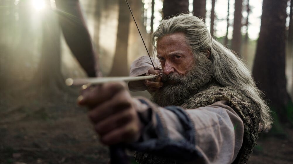 Robin Hood aiming a bow and arrow