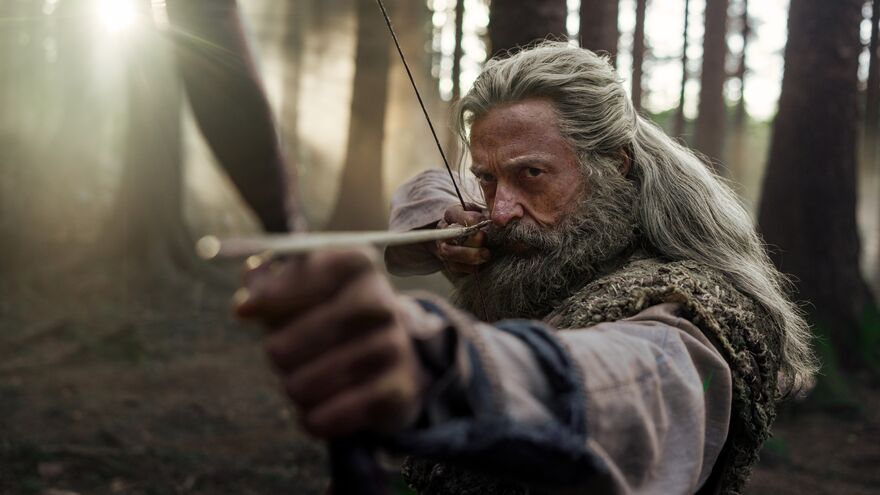 Robin Hood aiming a bow and arrow