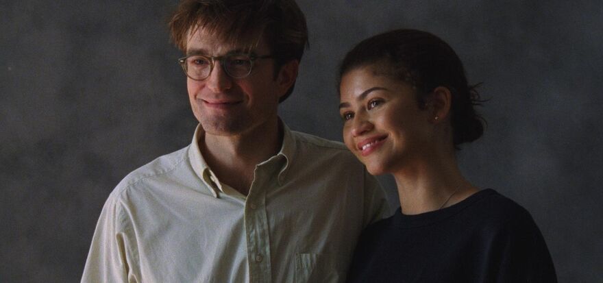 A couple posing for a photo together