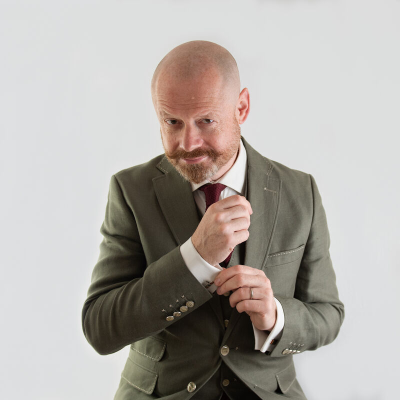 Alistair Barrie in a green suit