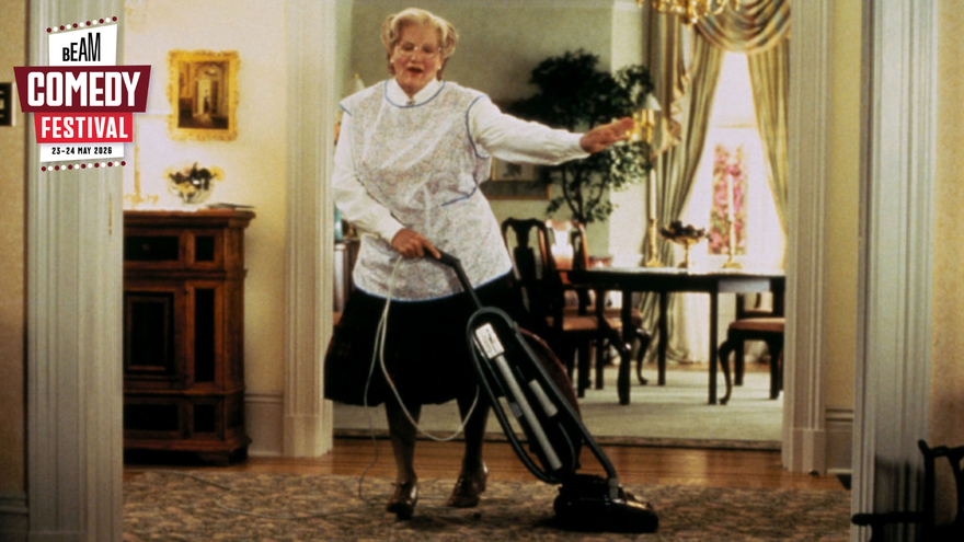 Mrs Doubtfire holding hoover